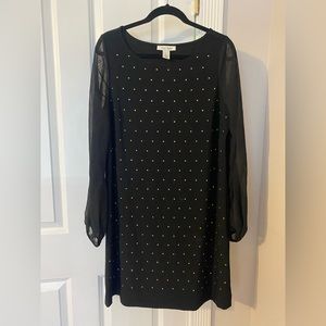 Little black dress with gold embellishments and sheer sleeves